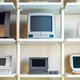 A portion of his collection. Starting at the top left and going clockwise: Twentieth Anniversary Macintosh, original iMac G3, G4 Cube, G3 iBook, Powerbook 100, and Macintosh Portable.